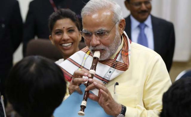 modi plays flute in japan