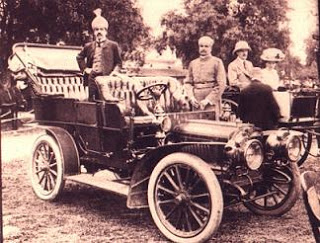 Nizam VII of Hyderabad poses in a car, one of the large fleet owned by him